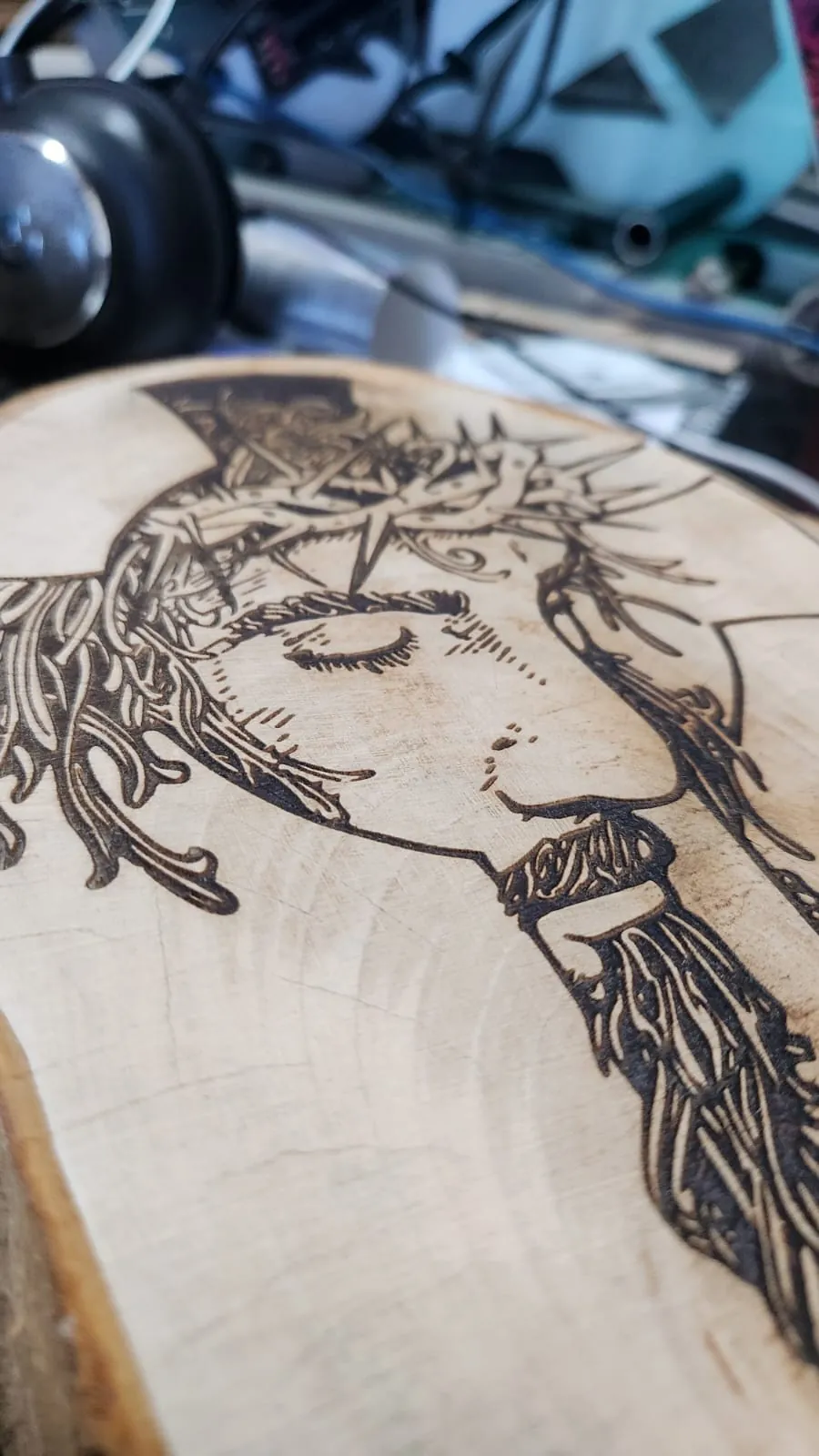 Detailed laser engraving on a wooden panel